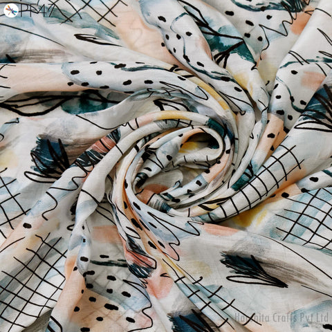 The image is a close-up view of a fabric with a colorful, abstract pattern featuring various shapes, lines, and colors.