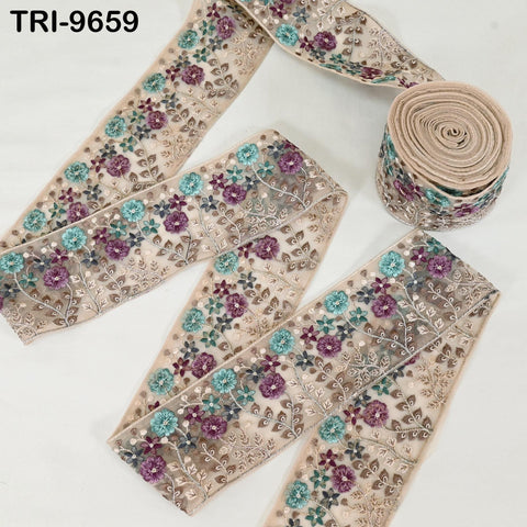 a decorative fabric with a floral pattern, including purple and blue flowers, arranged in a visually appealing manner.