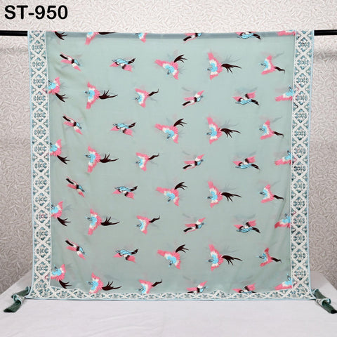 a light green fabric with a repeating pattern of pink and black birds. The pattern is displayed on a white background, and the fabric is framed by a decorative border.