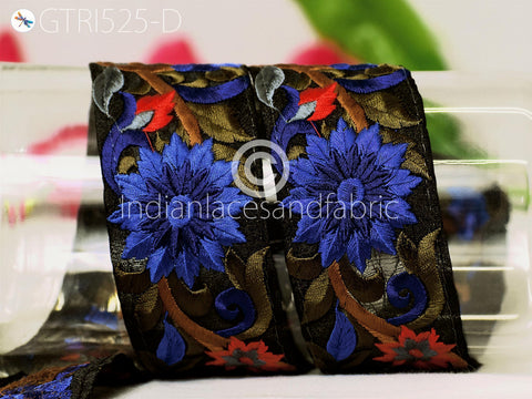 a pair of decorative fabric pieces with intricate floral patterns in shades of blue, red, and brown.