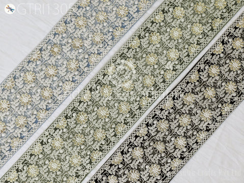 three identical floral patterns with a repeating design of white flowers on a black background.