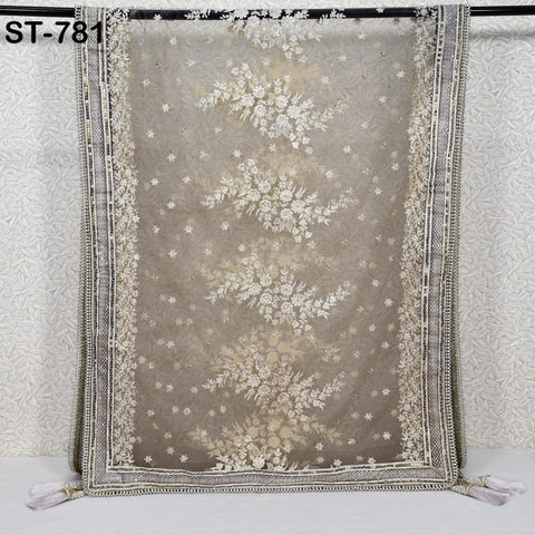 a decorative fabric with a floral pattern, hanging on a wall.