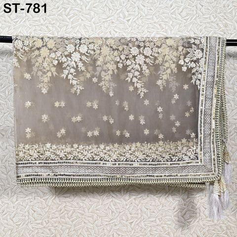 a decorative fabric with a floral pattern, hanging on a wall.