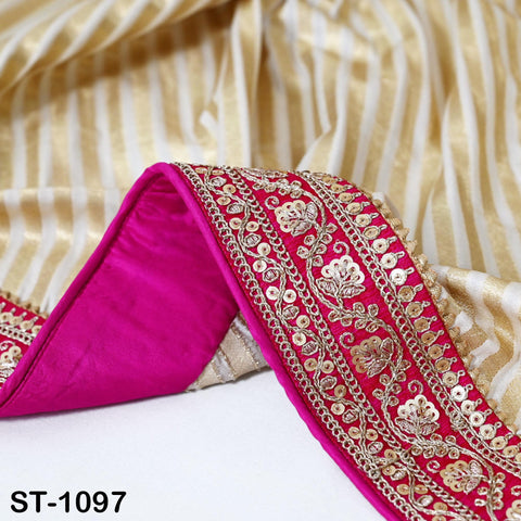 a close-up view of a decorative fabric with a pink and gold color scheme. The fabric has a floral pattern and a metallic trim, creating an elegant and eye-catching design.