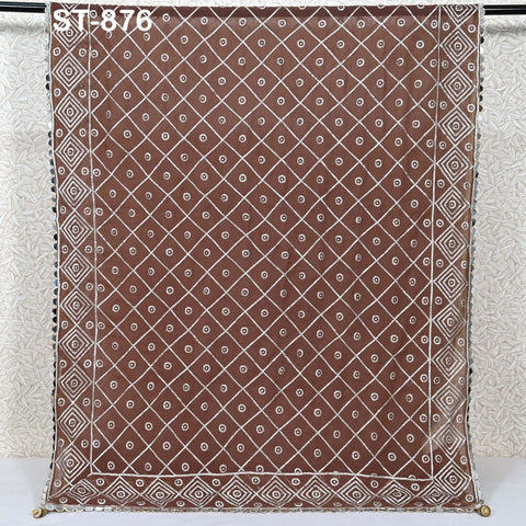 a brown and white patterned fabric with a diamond-like design.