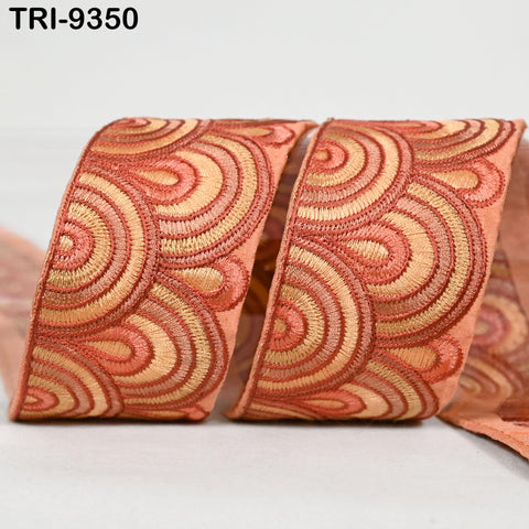 a decorative ribbon with a repeating pattern of orange and yellow circles.
