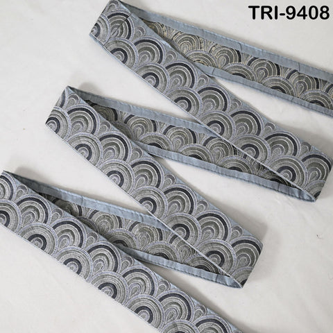 a set of gray and black patterned fabric pieces arranged in a zigzag pattern on a white background.
