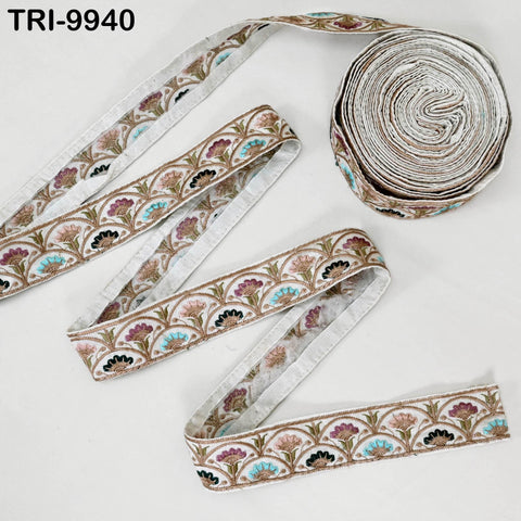 a roll of decorative fabric with a floral pattern, and there is a single piece of the fabric on the right side of the roll.