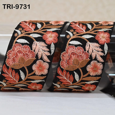 two pieces of black fabric with a floral pattern, featuring red and orange flowers and leaves. The text "TRI-971" is visible in the top left corner of the image.