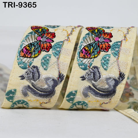 two pieces of fabric with colorful butterfly designs and leaves.