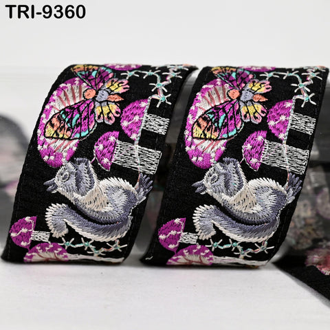 two black and white ribbons with colorful butterfly and squirrel designs.