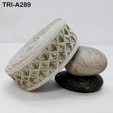 a decorative fabric with a floral pattern, placed on top of two rocks.