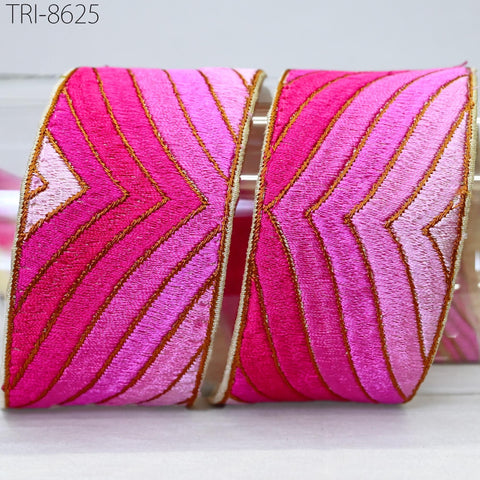 Two decorative ribbons with a pink and gold striped pattern, placed side by side.