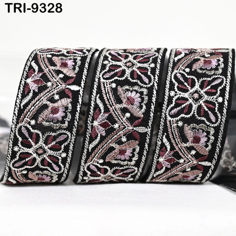 three decorative fabric pieces with intricate floral patterns in black and pink colors.