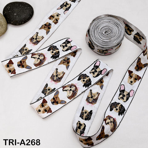a collection of dog-themed ribbons and a rock on a white surface.