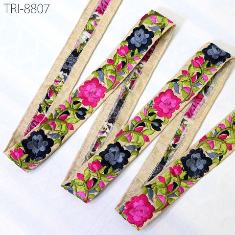 a collection of colorful, floral-patterned fabric pieces arranged on a white background.