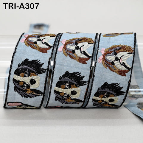 a roll of embroidered fabric with a repeating pattern of dog faces on it.