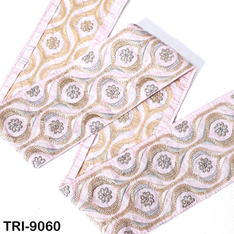 a decorative fabric with a repeating floral pattern in shades of pink and gold. The fabric appears to be made of a soft, plush material and is displayed against a white background.