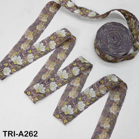 a collection of fabric ribbons with a floral pattern, including a large ribbon with a purple and white floral design and a smaller ribbon with a similar pattern.