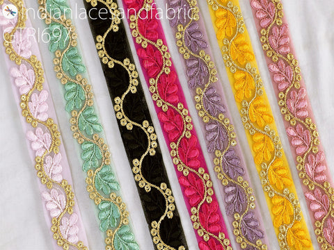 a collection of colorful, decorative fabric strips with intricate embroidered patterns.