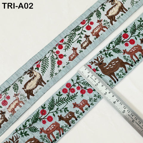 two pieces of fabric with a repeating pattern of deer and flowers. The fabric is displayed on a white background, and a ruler is placed next to it, indicating the size of the fabric.