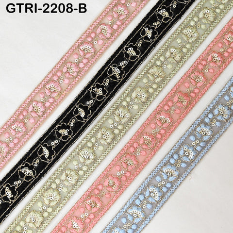 a collection of decorative fabric pieces, including a black and pink floral pattern, a pink and white floral pattern, and a blue and white floral pattern. The fabric pieces are arranged in a row, showcasing their intricate designs and vibrant colors.