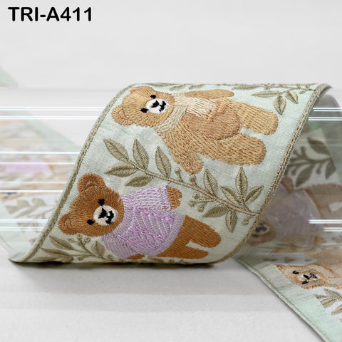 a decorative ribbon with a repeating pattern of brown teddy bears wearing pink sweaters.
