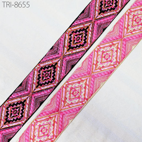 two pieces of fabric with a geometric pattern in shades of pink and black. The fabric appears to be a decorative textile, possibly used for embellishment or clothing.