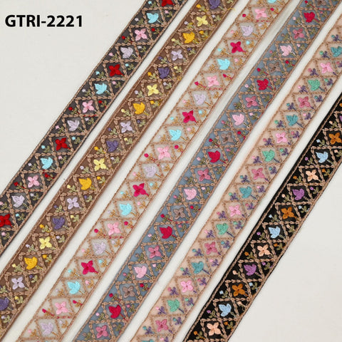 a collection of colorful, patterned fabric strips arranged in a row.