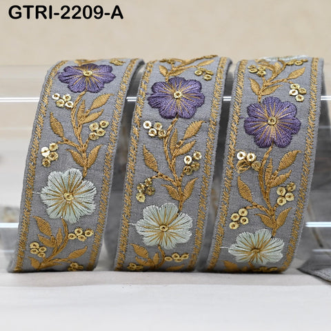 three decorative fabric pieces with intricate floral embroidery in shades of purple and gold. The pieces are arranged in a row, with the middle one being the largest and the other two being smaller in size.