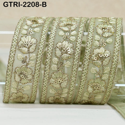 a close-up view of a decorative fabric with a floral pattern, featuring three identical pieces arranged in a row.