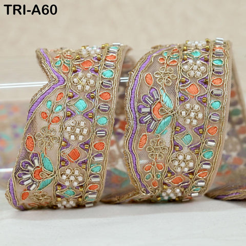 a decorative fabric with a floral pattern and colorful beads or sequins.