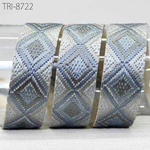 three identical woven fabric pieces with a diamond pattern in shades of blue and gray.