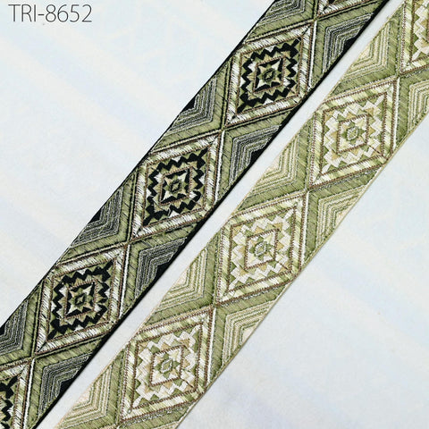 two pieces of fabric with a geometric diamond pattern in shades of green and black.