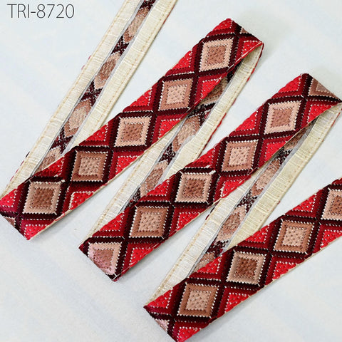 a collection of decorative fabric pieces with a repeating diamond pattern in shades of red and brown. The fabric appears to be made of a woven material, possibly cotton or linen, and is arranged in a zigzag pattern. The text "TRI-8720" is visible in the image.