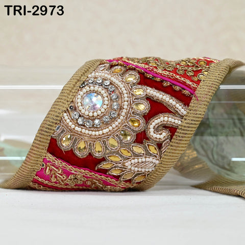 gold patchwork embroidered trim featuring red, maroon, and gold motifs, shown alongside a ruler indicating its width.