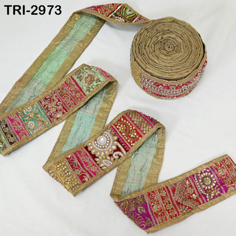 Gold patchwork embellishment trim with floral and traditional motifs.